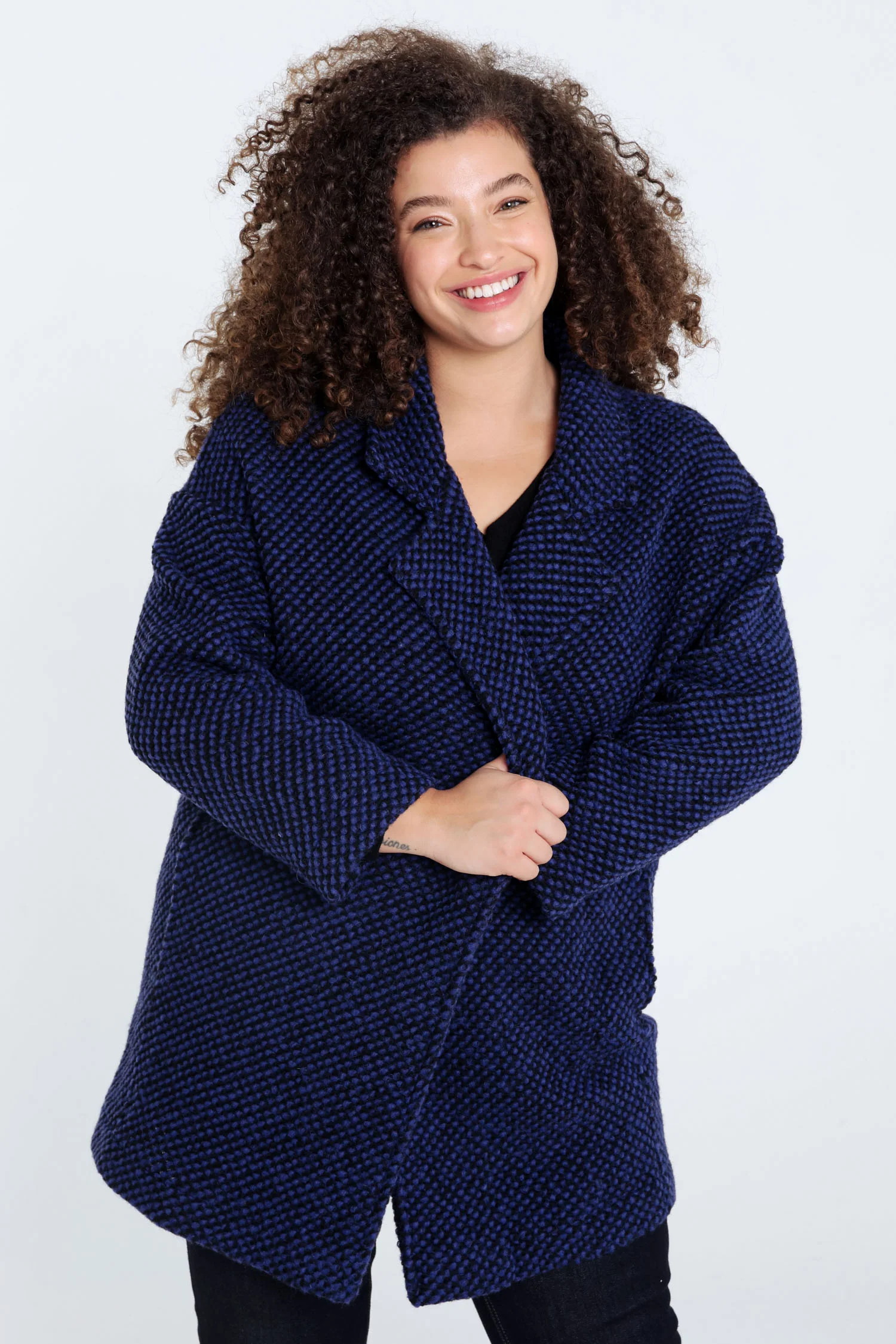 Manteau uni en tissu moucheté avec laine